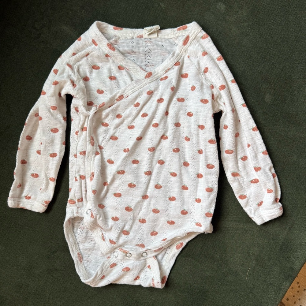 Kate Quinn Apple onesie